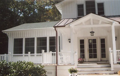 Completed home addition with white trim and covered entry in Delaware County